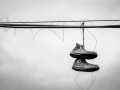 Shoes on a wire by Jasmine Hirst